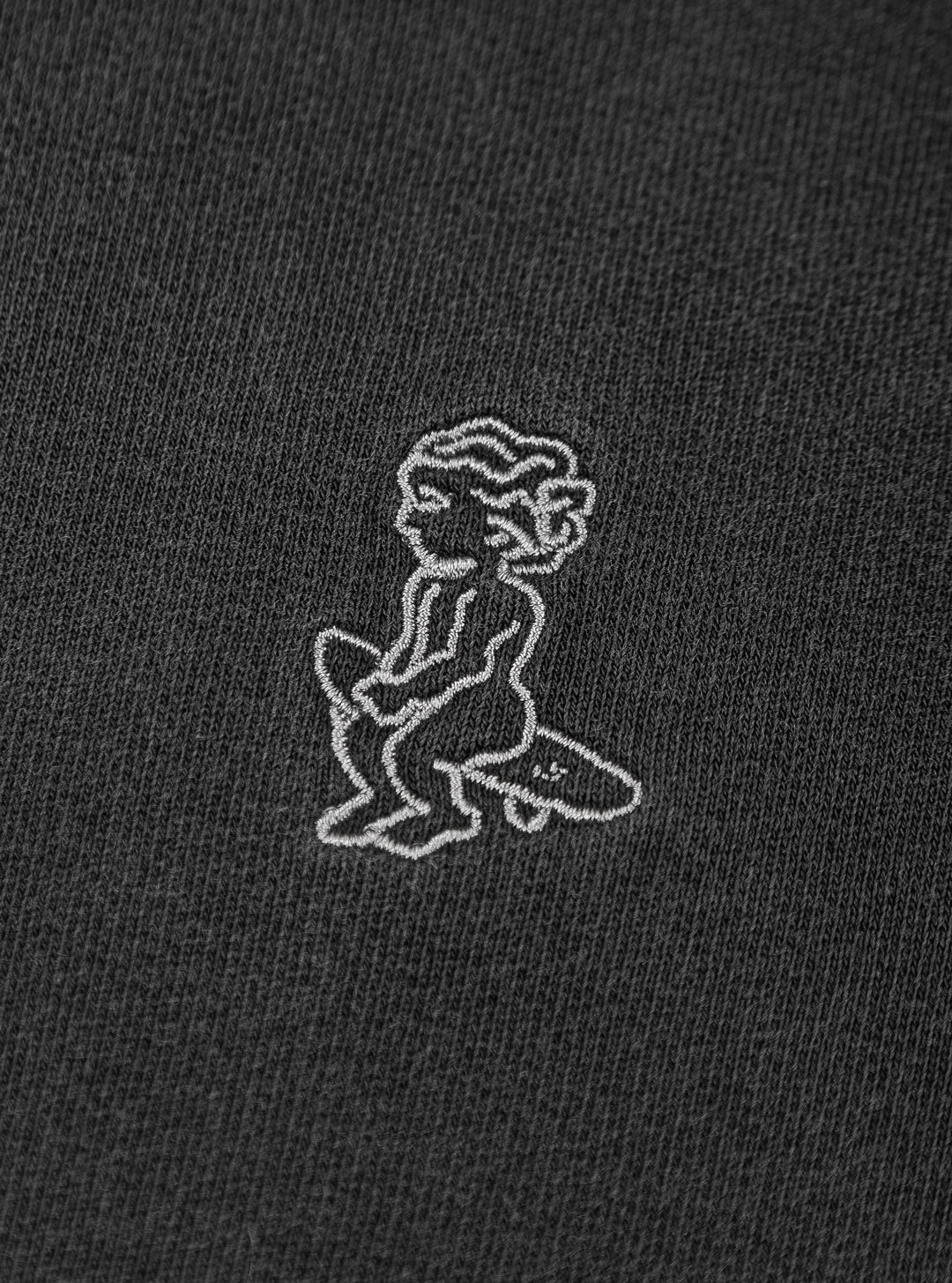 Cotton vest in grey washed, constructed from soft fabric, designed with a relaxed, loose fit for ease of movement. The vest features a subtle embroidered design on the chest, adding minimal detailing.